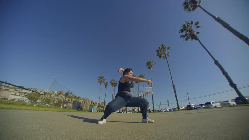 Sunny park and a woman dancing