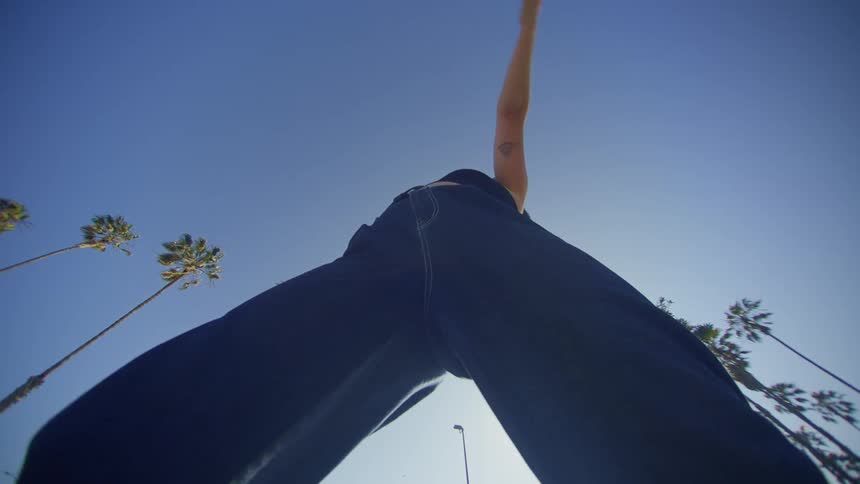 Woman dancing in jeans and a black top