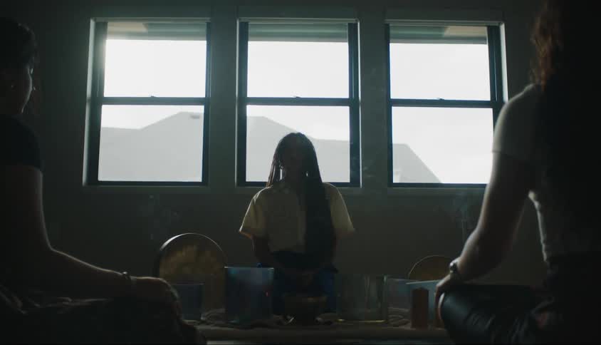 Three women sitting in a room with essence and concentrated