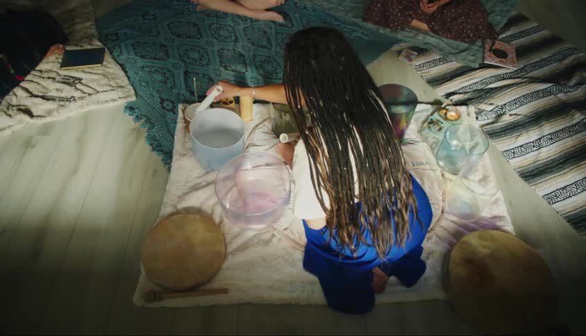 Woman sitting and doing a ritual