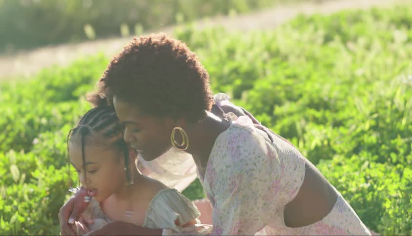 Mother in an openair garden with her daughter