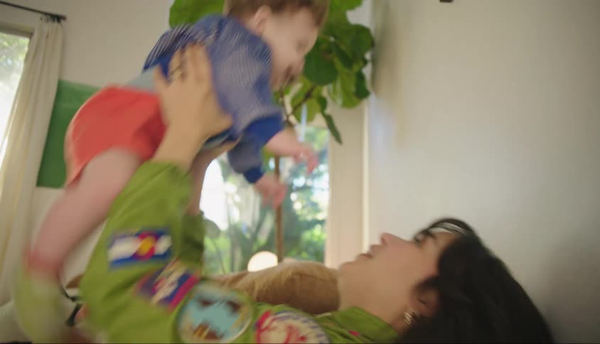 Mother sitting playing with her little son