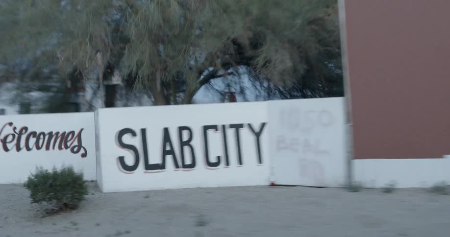 Passing view of a welcome sign  in a small city