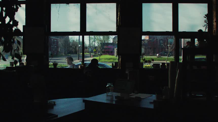 Silhouette of the interior of an establishment with windows that let in light
