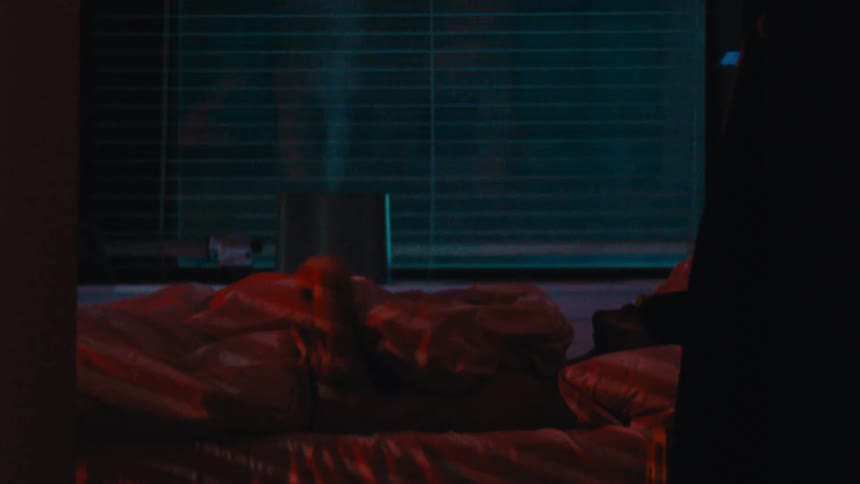 A man puts in earplugs and goes to bed
