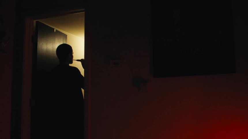 Silhouette of a man brushing his teeth