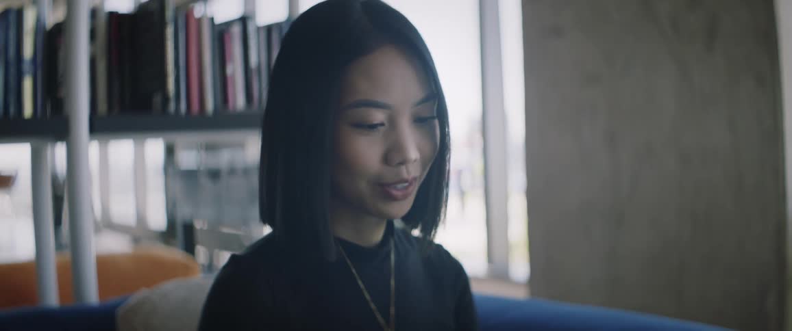 Portrait of a young shorthaired woman sitting in an office environment