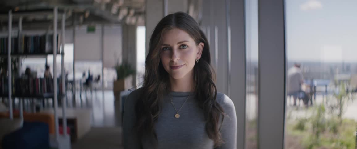 Portrait of a young woman smiling while indoors