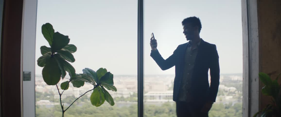 Man in casual clothes talking on cell phone