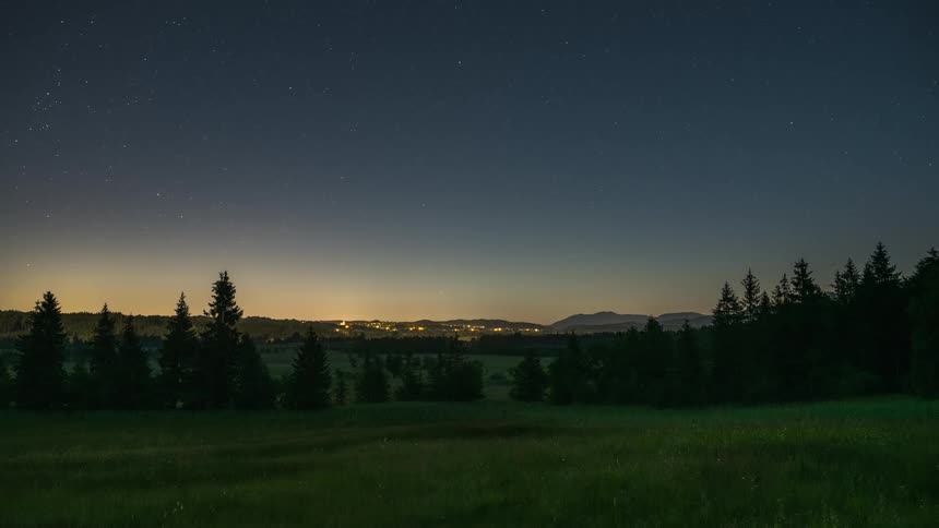 The sun sets and the stars shine on the valley