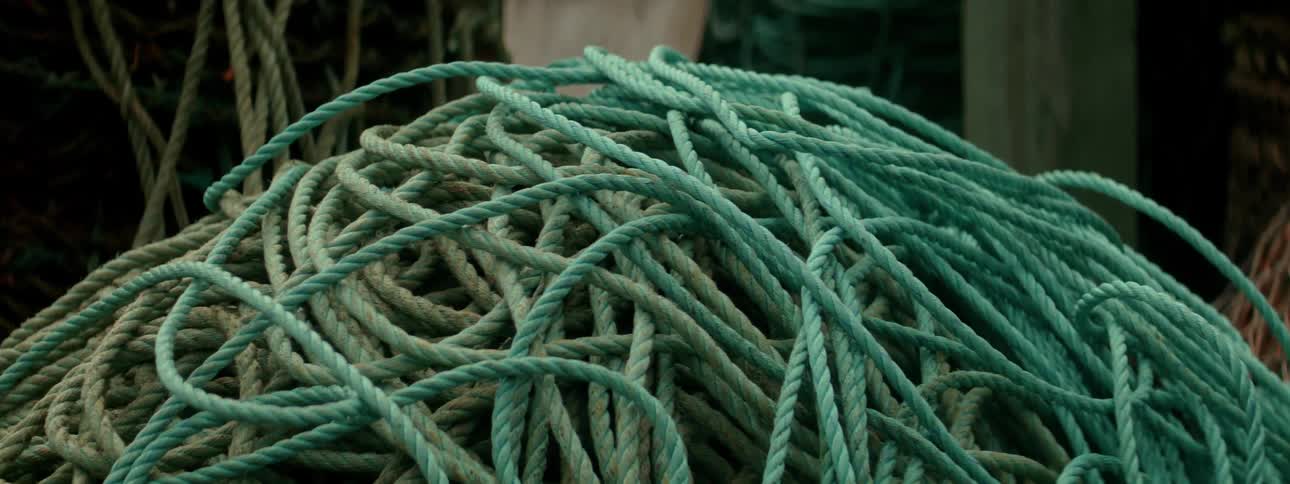 A pile of blue and green ropes