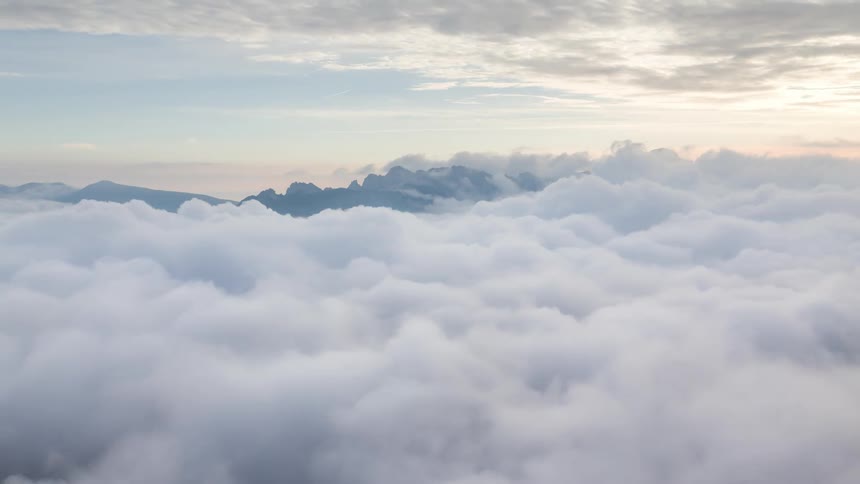 A vast horizon full of dense white clouds moving quickly