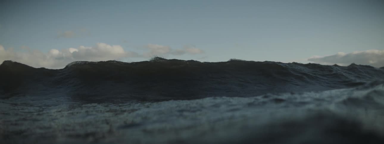 Rolling wave heading straight towards the camera and then covering it up