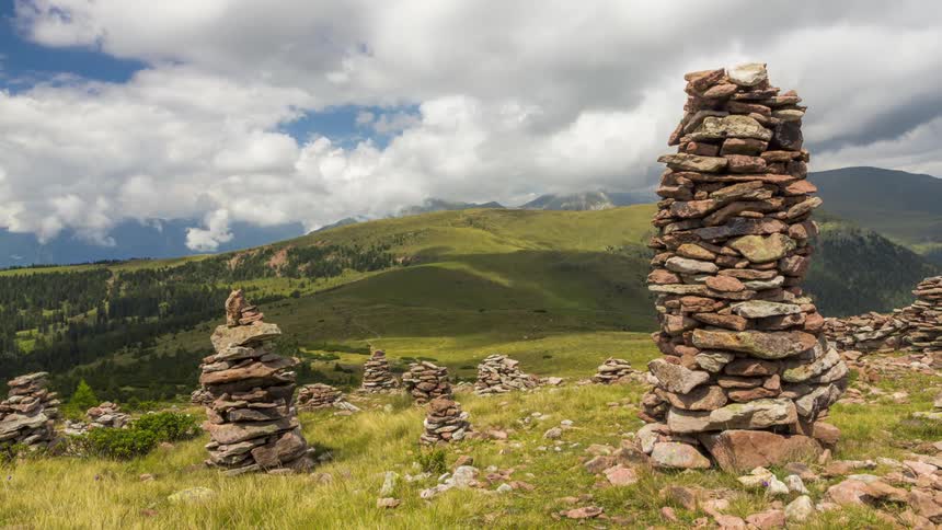 Stones stacked on top of each other on a hill in the mountains
