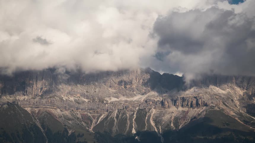 Landscape of mountain ranges with cloudy clouds passing by
