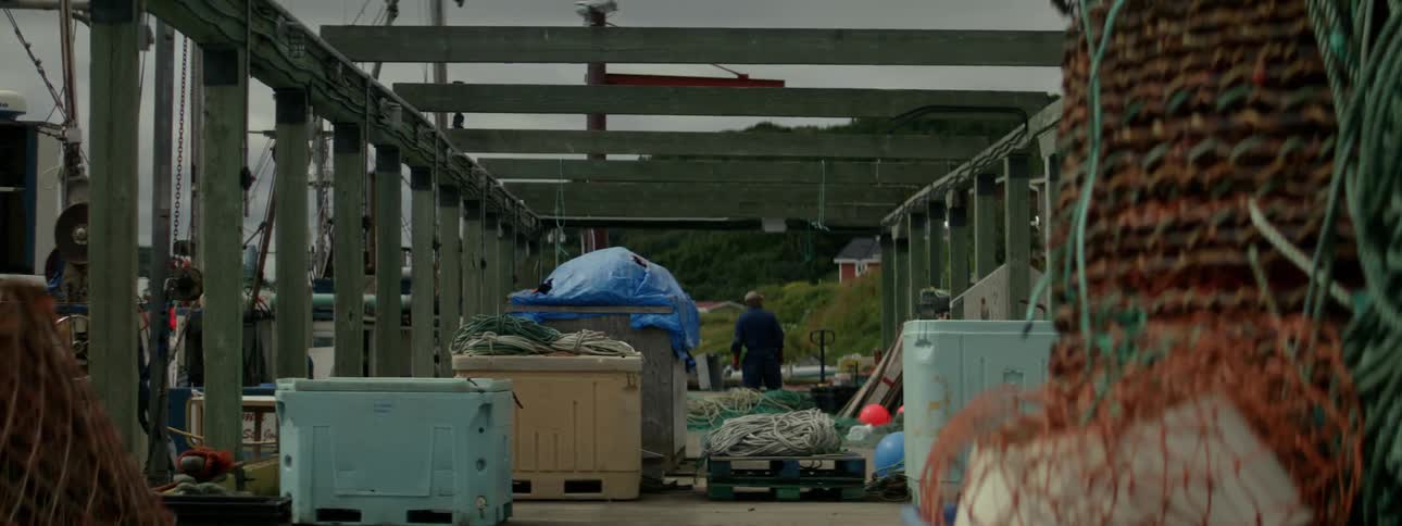 Equipment and boxes and a man in the background