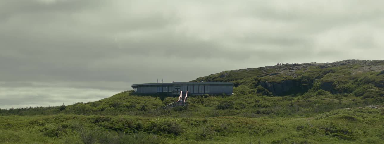 A long house built into the side of a small hill
