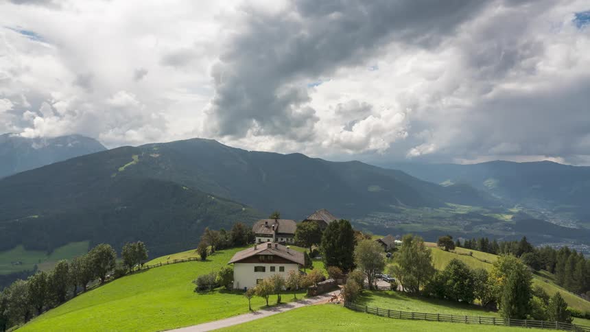 Landscape of houses on a mountain with cloudy sky