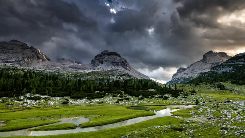 Dramatic natural landscape with rocky mountains and a cloudy sky