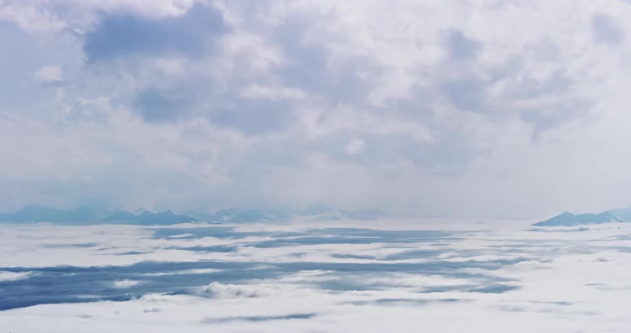 Aerial landscape of two layers of clouds passing by