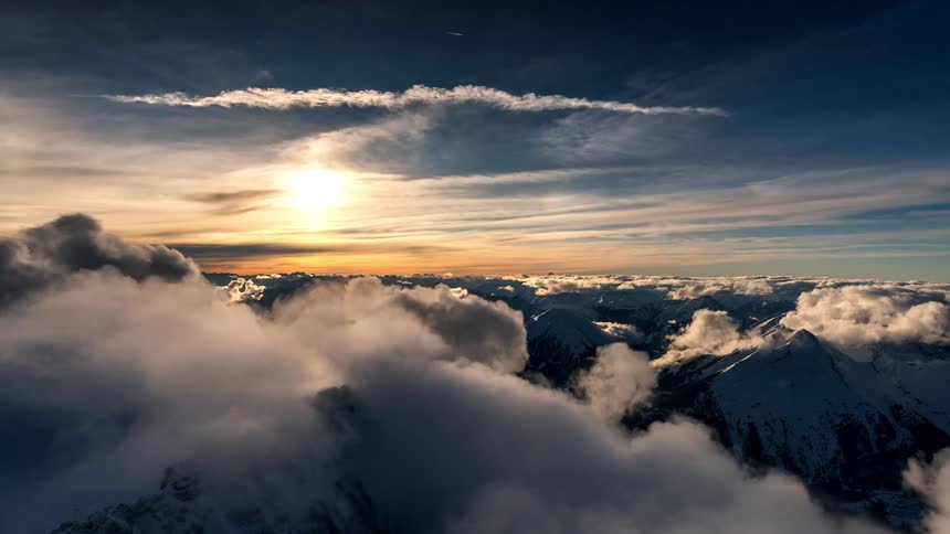 Aerial panorama of mountain ranges and clouds passing by