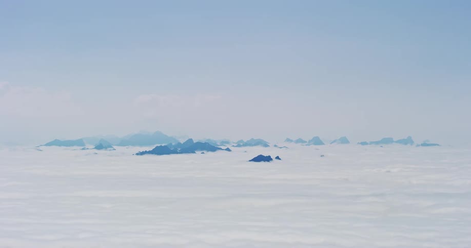 Aerial scenery of a sea of clouds and mountain peaks
