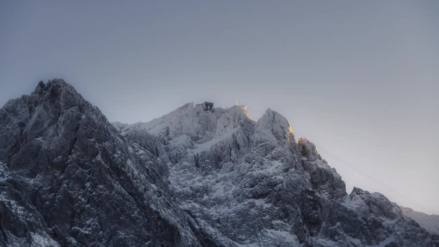 Landscape of rocky mountains covered by snow