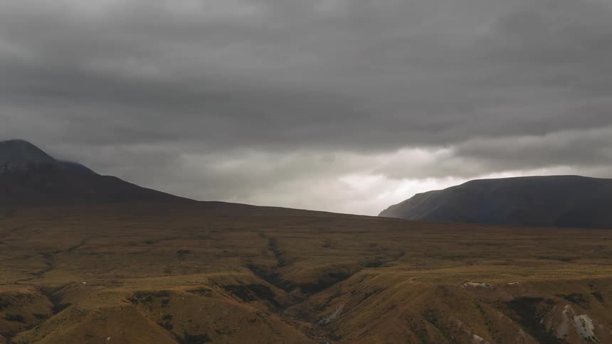 Mountains landscape under a cloudy and stormy sky