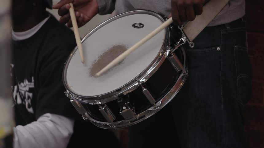 Close up of a drummer beating on his snare drum