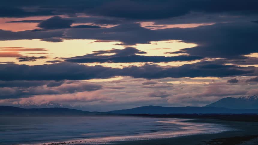 The tide moves back and forth on the beach