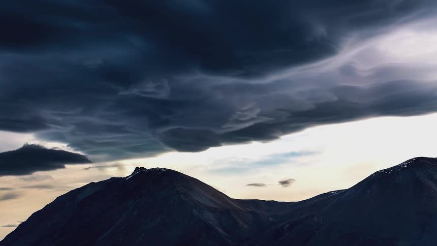 Mountain range with a cloud storm passing by
