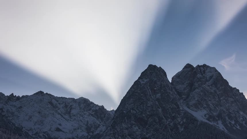 Sun reflection through snowy mountains