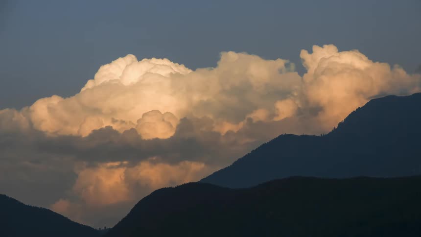 Clouds passing over a mountain range