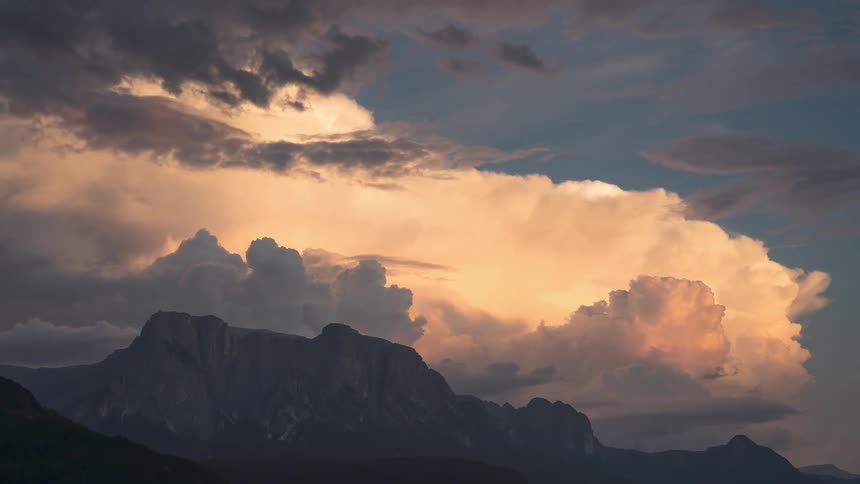Sea of moving clouds above mountain ranges