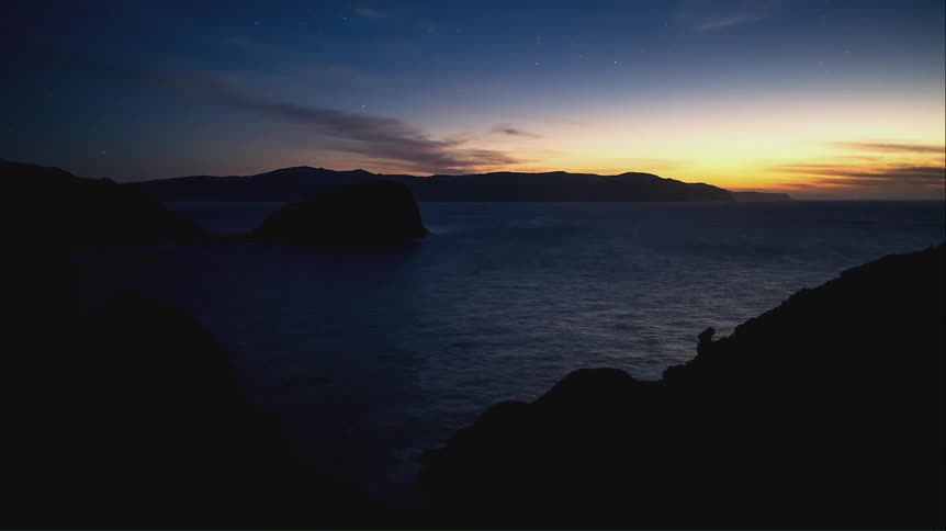The sun sets on the shore