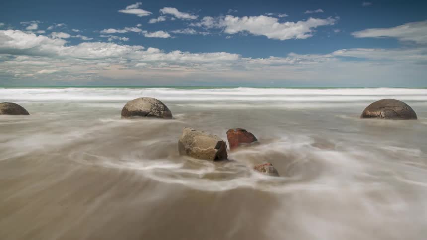 Landscape of rocks on a beach on a cloudy day