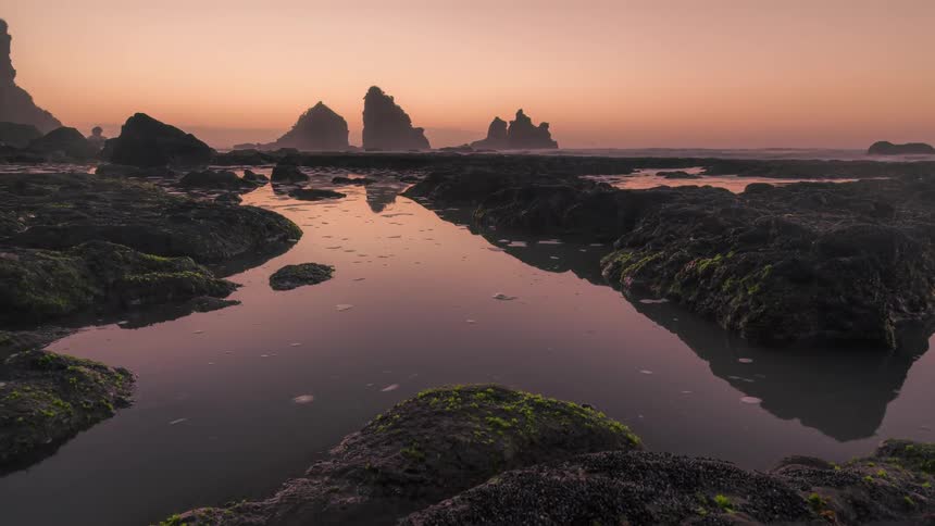 The tide coming in and out of a coastal rock formation