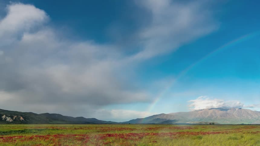 A rainbow covers the landscape