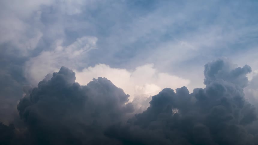 Time lapse of clouds formations rolling under a blue sky