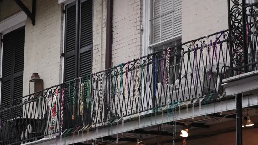 Colorful beads hang from the balcony railing
