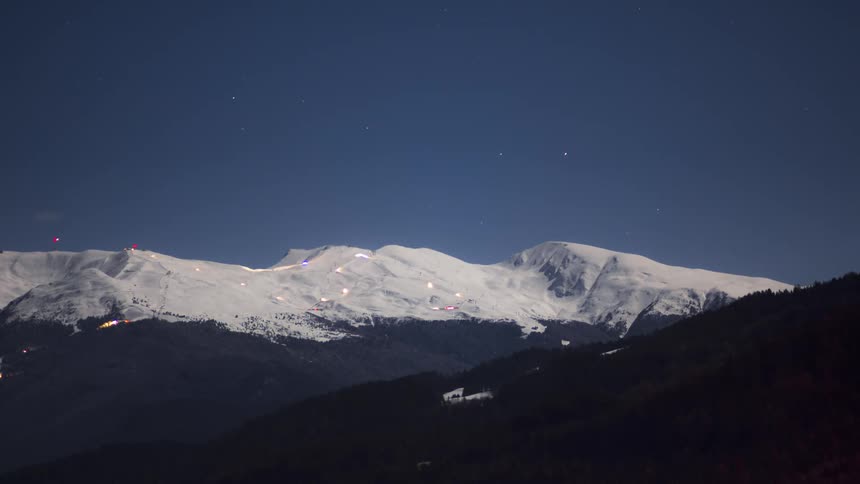 Snowy mountains with vehicle traffic lights
