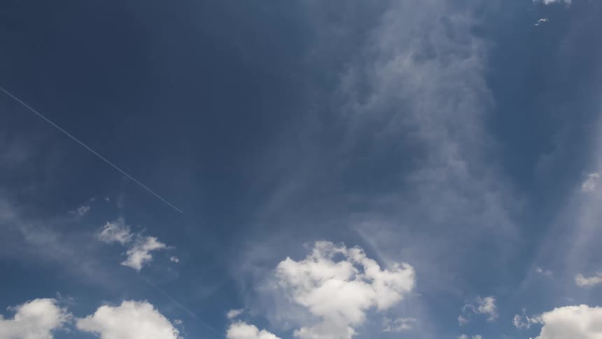 Blue sky with clouds passing by