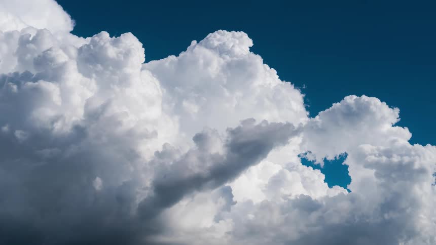 Blue sky with moving clouds