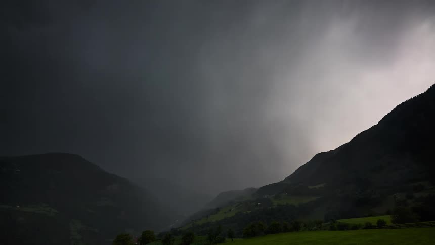 Cloudy sky with dense clouds and nebulae above mountains