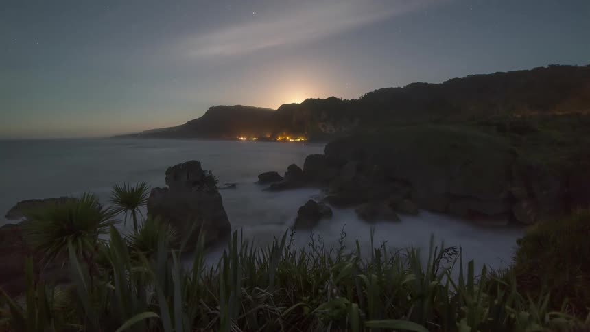 Seaside coast with sun rising on the horizon