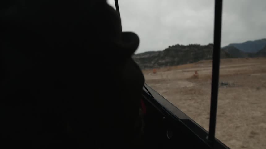Man closing the windows on his aircraft from inside