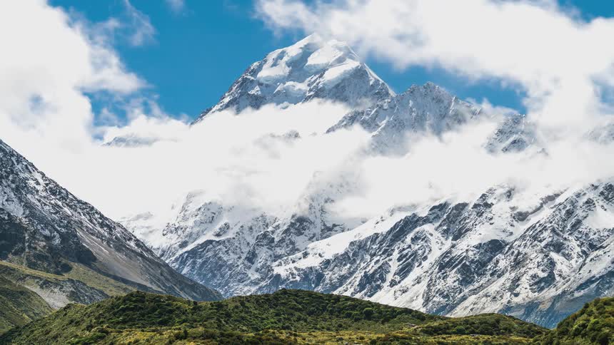 Greenish and snowy mountain ranges during the day