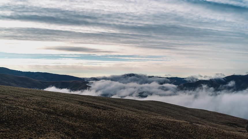 Mist rolls over the hills on the landscape