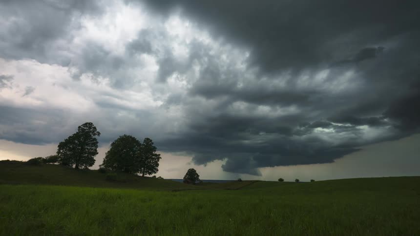 Storm clouds pour rain in the distance