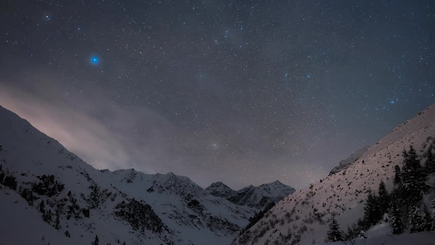 Mountains landscape with a day darkening with stars and dawning